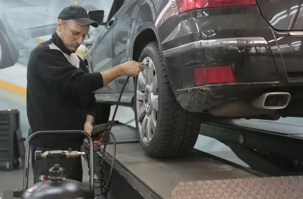 Man filling nitrogen in car tyre